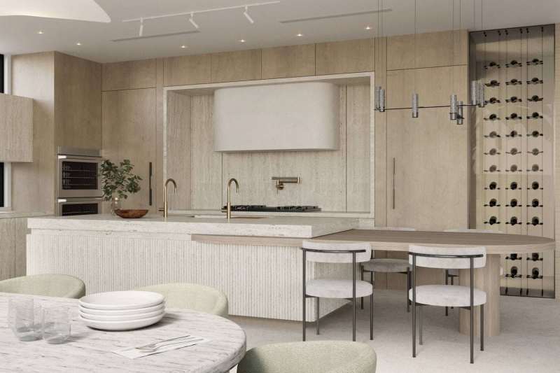 Organic Modern kitchen with porcelain-clad cabinetry, brass faucets, integrated wine wall, and a sculptural plaster range hood.