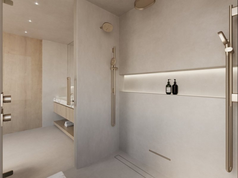 Microcement shower with integrated brass fixtures and a minimalist niche in an Organic Modern master bath retreat.