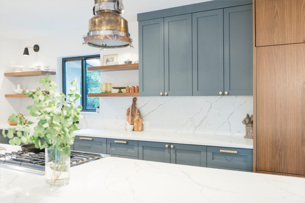 interior design blue cabinets and brass kitchen