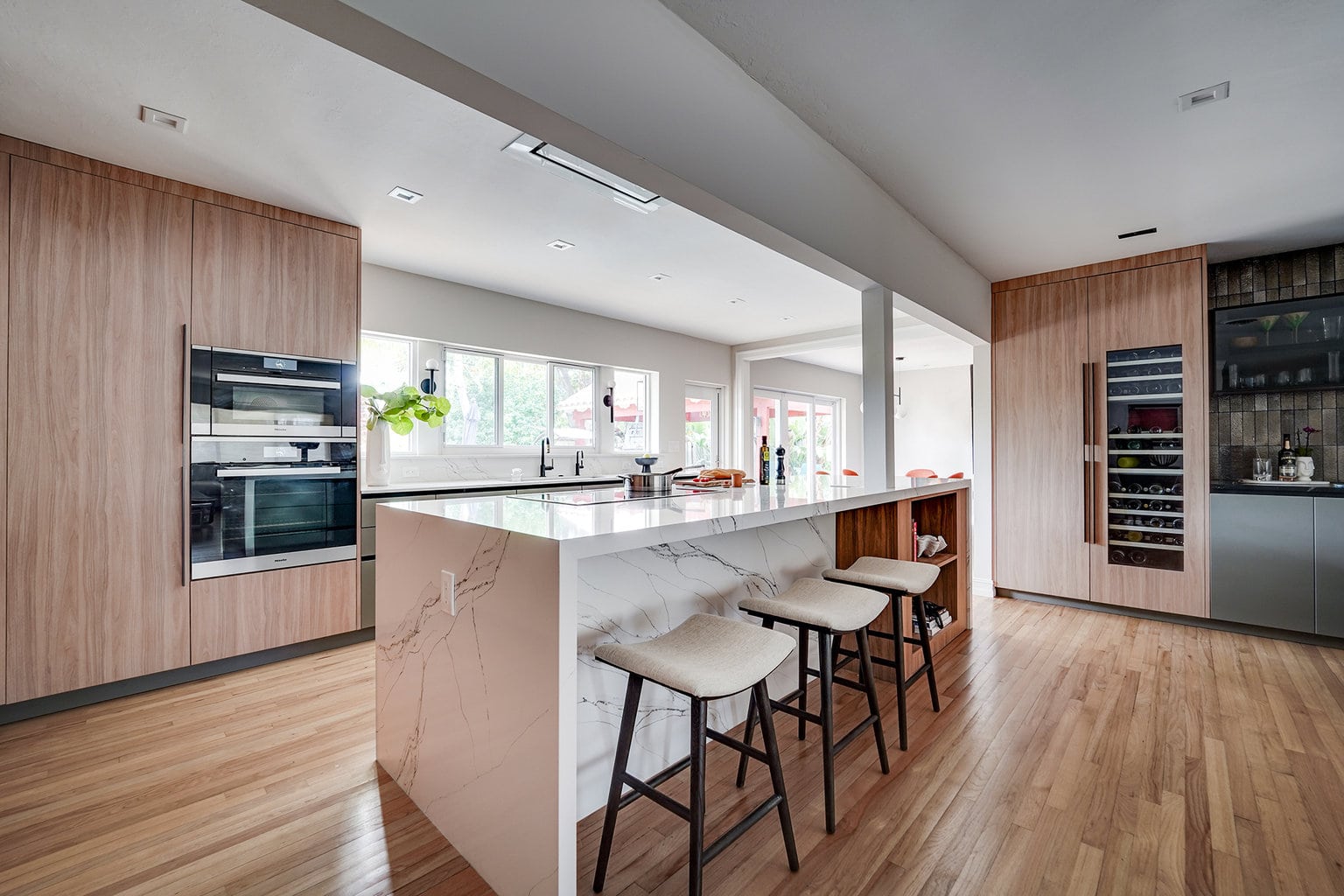 Island & bar area view in modern luxury kitchen by STUDIO 818 interior design & build management