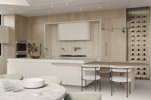Organic Modern kitchen with porcelain-clad cabinetry, brass faucets, integrated wine wall, and a sculptural plaster range hood.